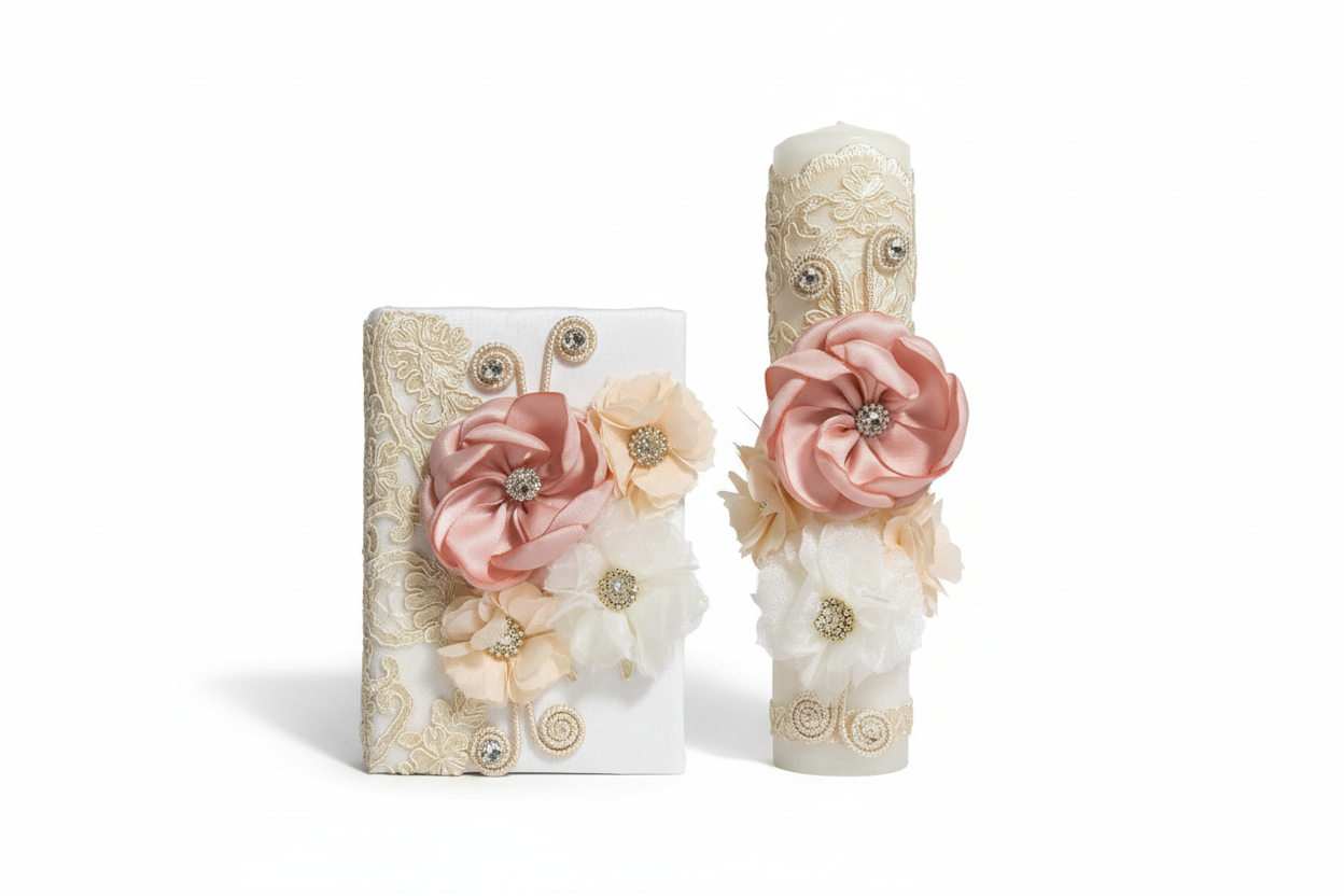 A set of two candles with lace details and peach-toned flowers on top, alongside a matching bible cover, all designed for a girl's first communion.